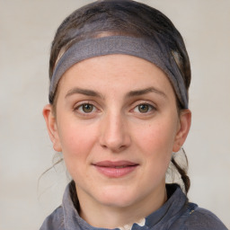 Joyful white young-adult female with medium  brown hair and blue eyes