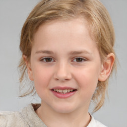 Joyful white child female with medium  brown hair and brown eyes