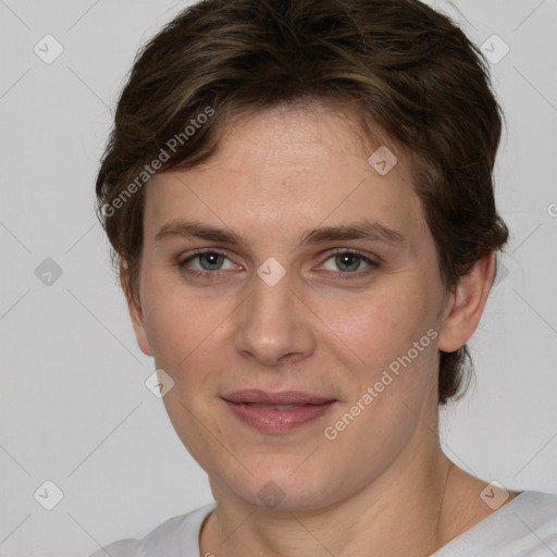 Joyful white young-adult female with short  brown hair and grey eyes