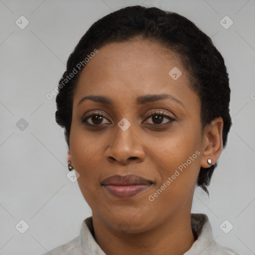 Joyful black adult female with short  black hair and brown eyes