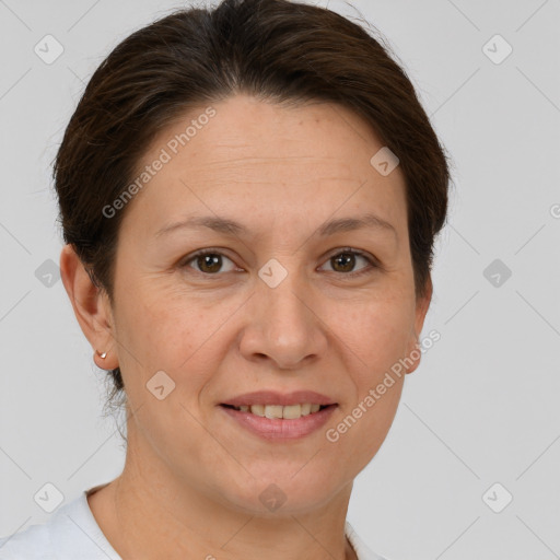 Joyful white adult female with short  brown hair and brown eyes