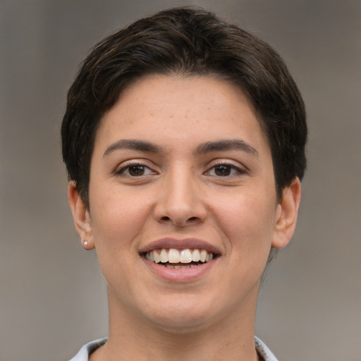 Joyful white young-adult female with short  brown hair and brown eyes