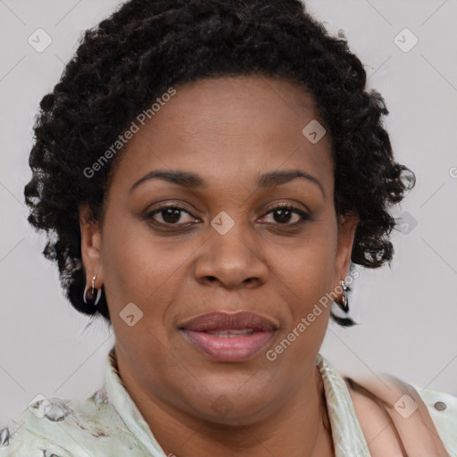 Joyful black adult female with short  brown hair and brown eyes