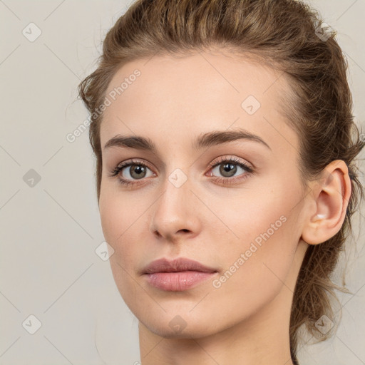 Neutral white young-adult female with long  brown hair and grey eyes