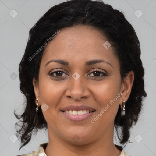 Joyful latino adult female with medium  brown hair and brown eyes