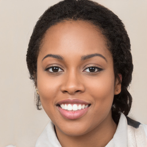 Joyful latino young-adult female with long  brown hair and brown eyes