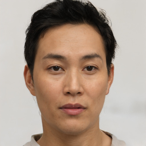 Neutral asian young-adult male with short  brown hair and brown eyes