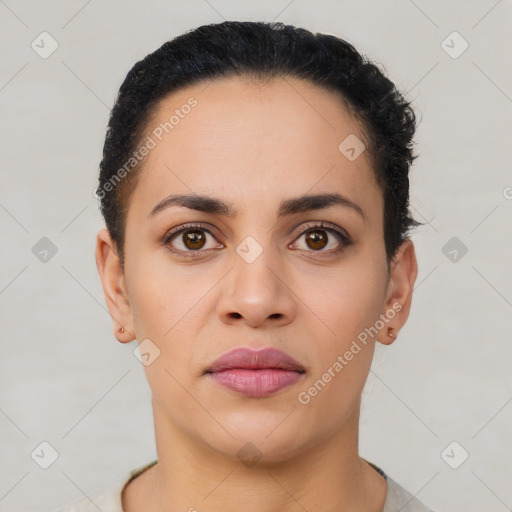 Joyful latino young-adult female with short  black hair and brown eyes