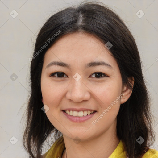 Joyful latino young-adult female with medium  brown hair and brown eyes