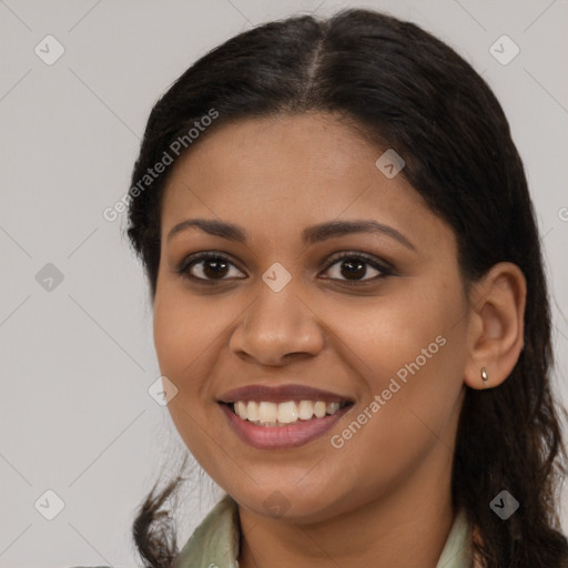 Joyful latino young-adult female with long  brown hair and brown eyes