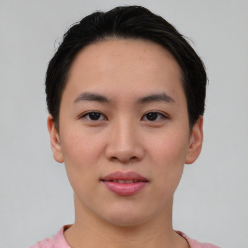 Joyful asian young-adult female with short  black hair and brown eyes