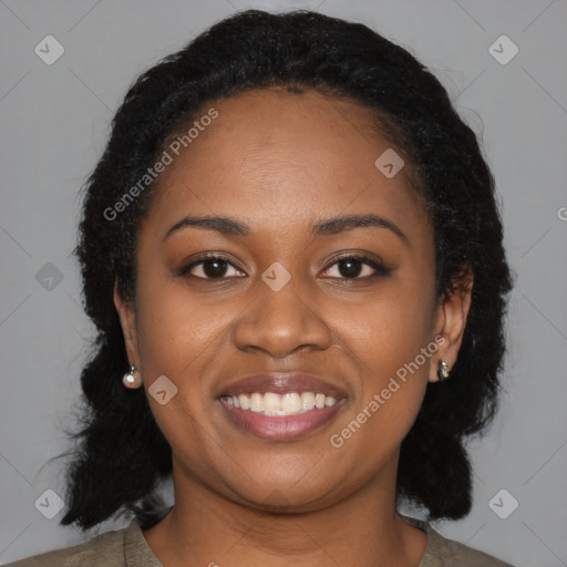 Joyful black young-adult female with medium  black hair and brown eyes