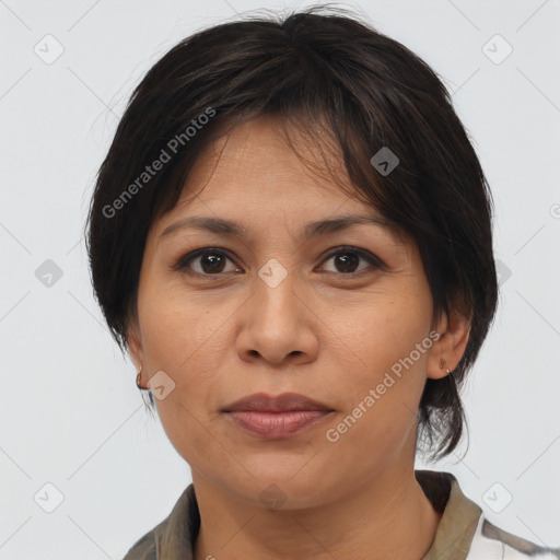 Joyful asian adult female with medium  brown hair and brown eyes