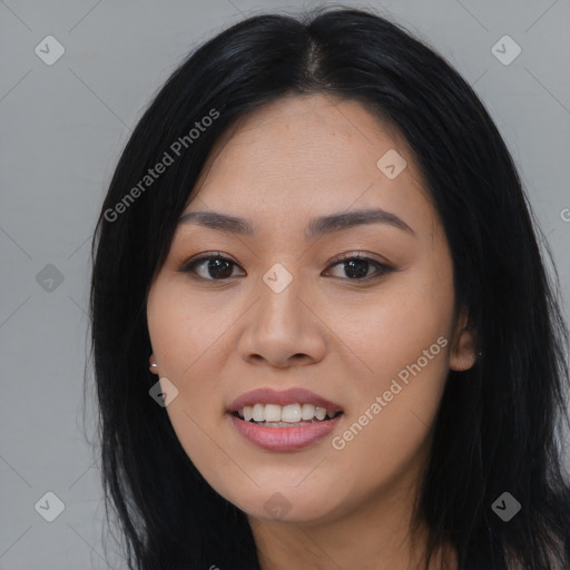 Joyful asian young-adult female with long  black hair and brown eyes