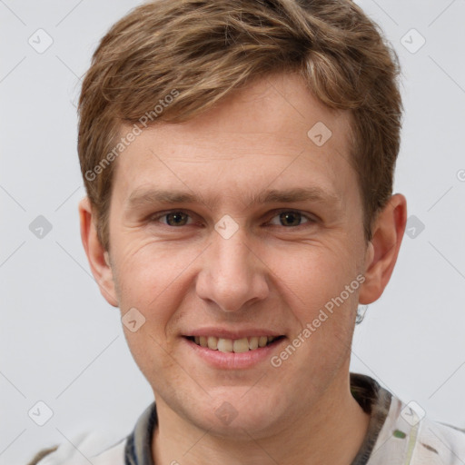 Joyful white adult male with short  brown hair and grey eyes