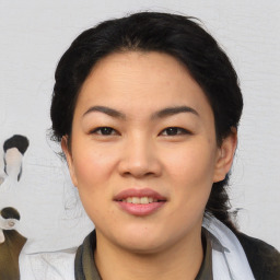 Joyful asian young-adult female with medium  black hair and brown eyes