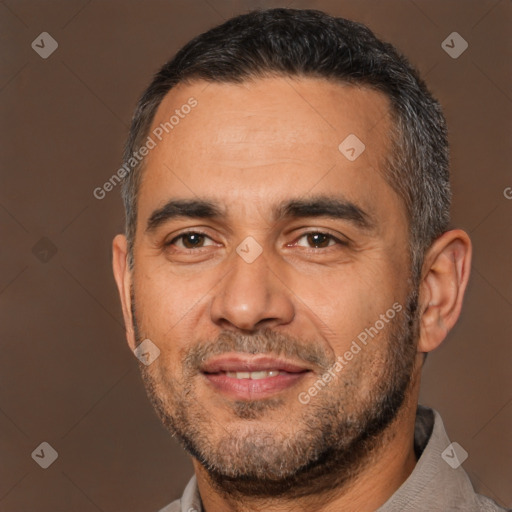 Joyful white adult male with short  black hair and brown eyes