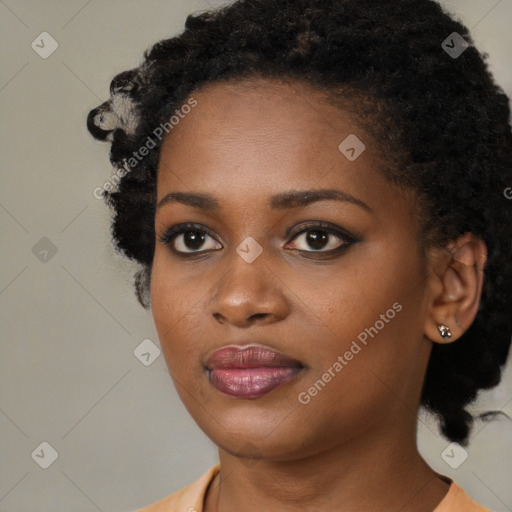 Joyful black young-adult female with medium  black hair and brown eyes