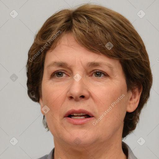 Joyful white adult female with medium  brown hair and grey eyes