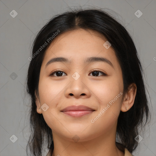 Joyful asian young-adult female with medium  black hair and brown eyes