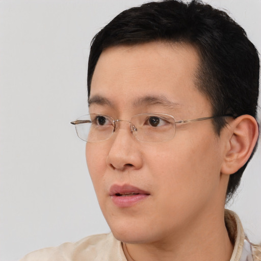 Neutral asian young-adult male with short  brown hair and brown eyes