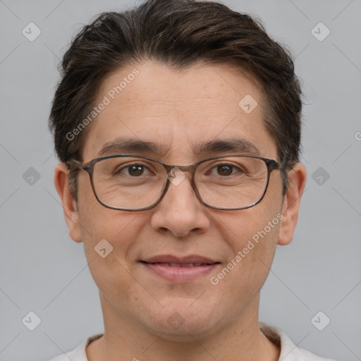 Joyful white adult male with short  brown hair and brown eyes