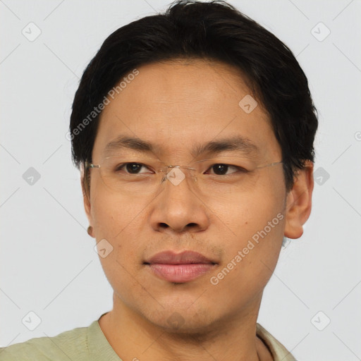 Joyful asian young-adult male with short  brown hair and brown eyes