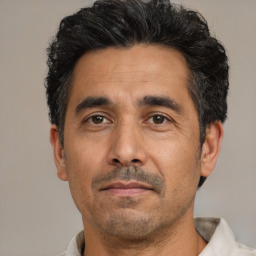 Neutral latino adult male with short  black hair and brown eyes