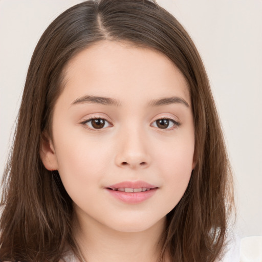 Joyful white child female with long  brown hair and brown eyes