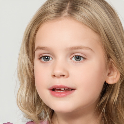 Joyful white child female with long  brown hair and grey eyes