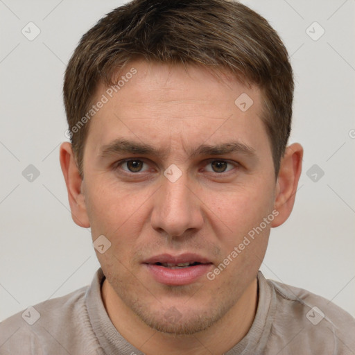 Joyful white adult male with short  brown hair and grey eyes