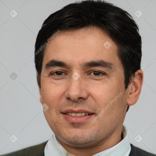 Joyful white adult male with short  black hair and brown eyes