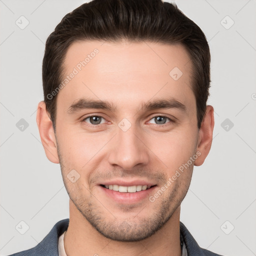 Joyful white young-adult male with short  brown hair and brown eyes