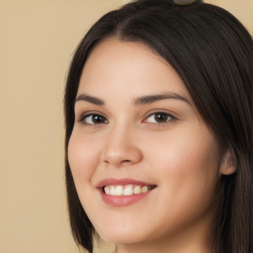 Joyful white young-adult female with long  brown hair and brown eyes