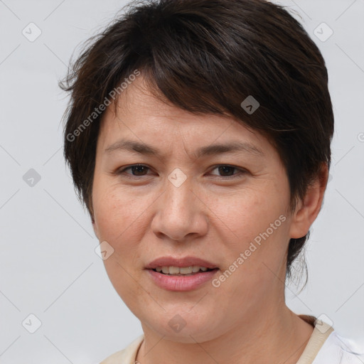 Joyful white adult female with short  brown hair and brown eyes