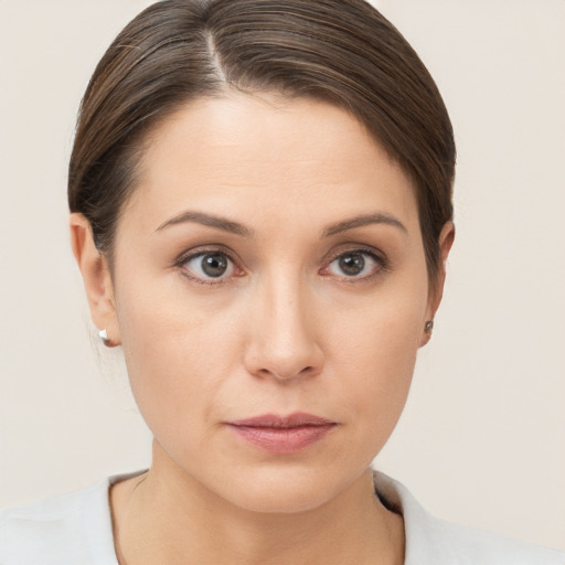 Neutral white young-adult female with short  brown hair and brown eyes