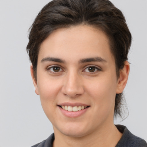 Joyful white young-adult female with medium  brown hair and brown eyes