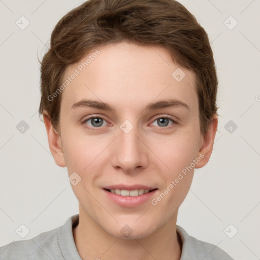 Joyful white young-adult female with short  brown hair and grey eyes