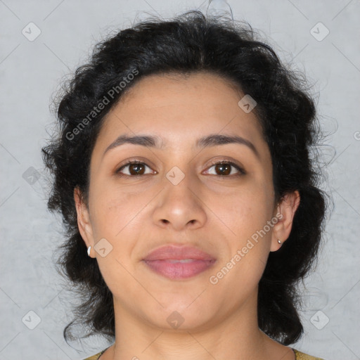 Joyful latino adult female with medium  brown hair and brown eyes