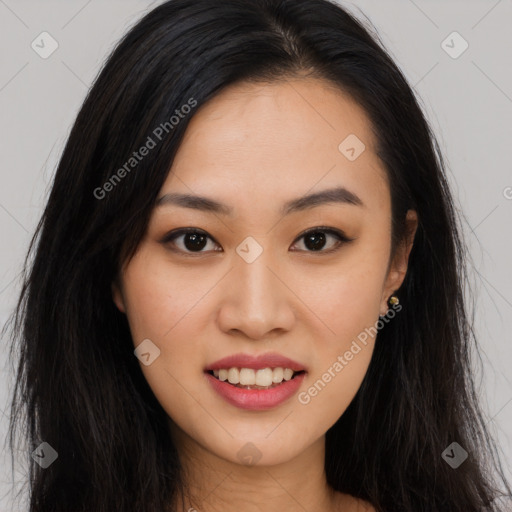 Joyful asian young-adult female with long  brown hair and brown eyes