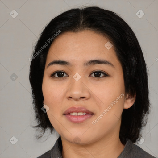 Joyful asian young-adult female with medium  black hair and brown eyes