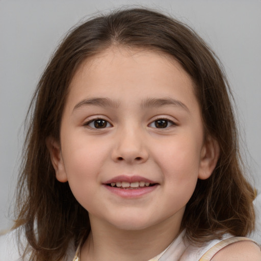 Joyful white child female with medium  brown hair and brown eyes