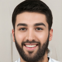 Joyful white young-adult male with short  black hair and brown eyes