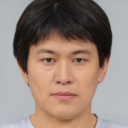 Neutral asian young-adult male with short  brown hair and brown eyes