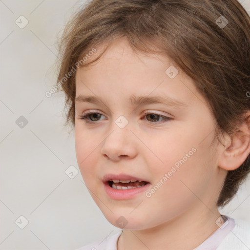 Joyful white child female with medium  brown hair and brown eyes