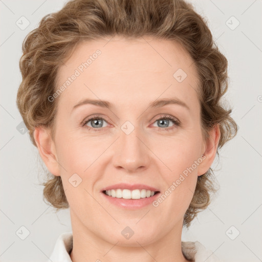 Joyful white young-adult female with medium  brown hair and blue eyes