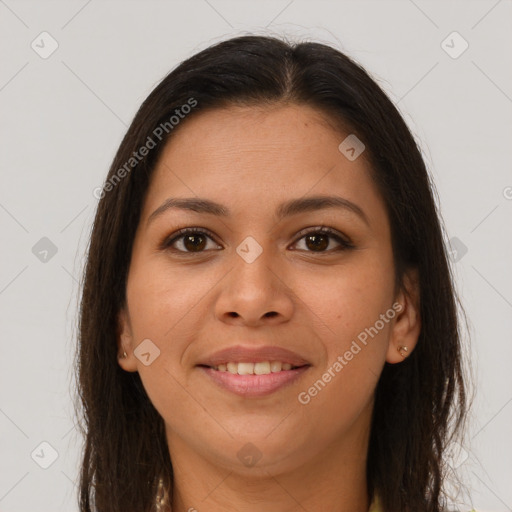 Joyful latino young-adult female with long  brown hair and brown eyes