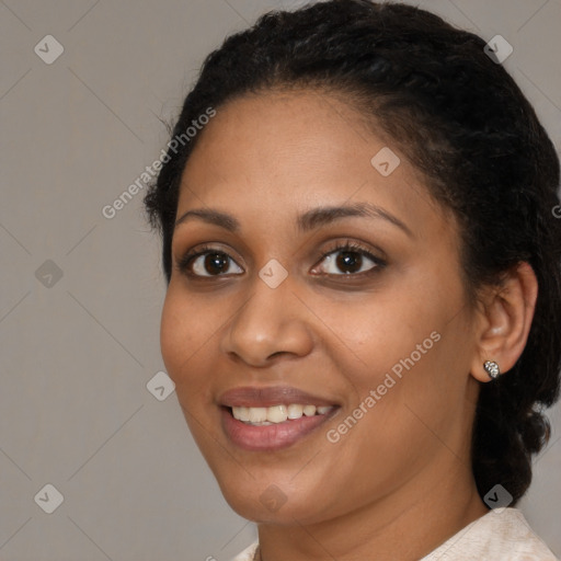 Joyful black young-adult female with medium  black hair and brown eyes