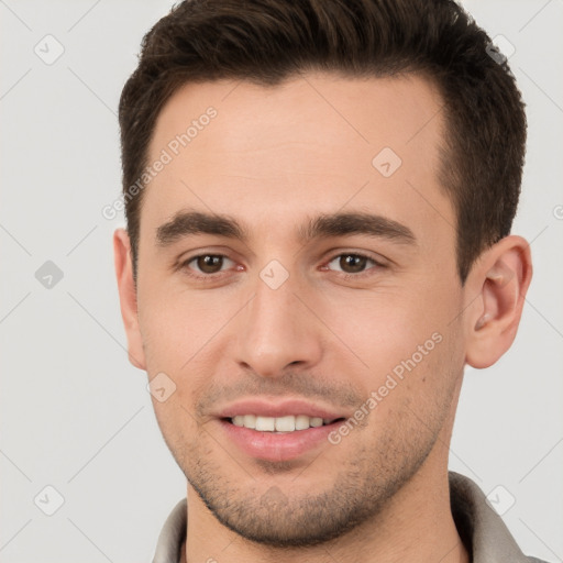 Joyful white young-adult male with short  brown hair and brown eyes