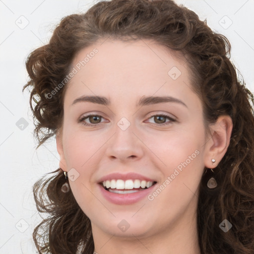 Joyful white young-adult female with long  brown hair and green eyes